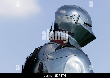 Medieval Knight in armour at a historical reenactment.