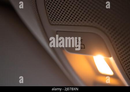 Closeup of cabin lights switch in car, light control panel inside a car interior. For reading etc. Stock Photo