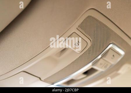 Closeup of cabin lights switch in car, light control panel inside a car interior. For reading etc. Stock Photo