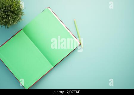 high angle view of open notepad on light color background  Stock Photo