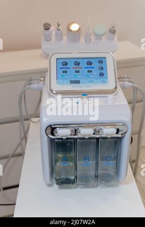 Hardware anti-aging procedure. Radio frequency lifting in beauty salon . Beauty machine for hydrodermabrasion and lifting .. Stock Photo