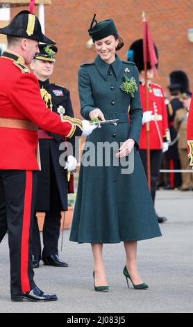The Duchess of Cambridge takes the traditional sprigs of shamrock to present to officers and guardsmen as she attends the 1st Battalion Irish Guards for the St Patrick's Day Parade, at Mons Barracks in Aldershot. Picture date: Thursday March 17, 2022. Stock Photo