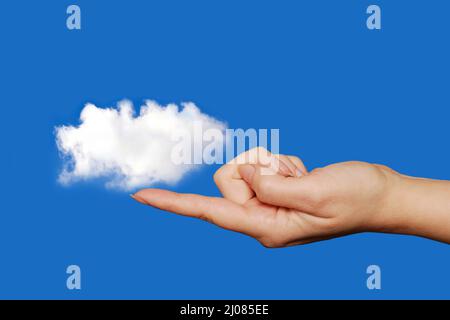 finger  holding or touching a cloud, data storage cloud computing concept Stock Photo