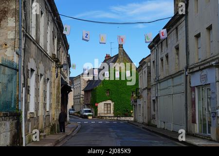 AZAY-LE-RIDEAU, FRANCE -24 JUN 2021- Street view of the village of Azay-le-Rideau, home of a landmark Renaissance castle, with suspended fabric lanter Stock Photo