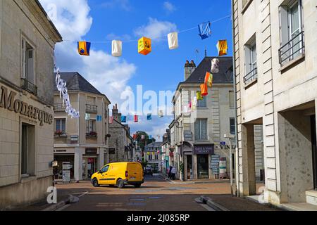 AZAY-LE-RIDEAU, FRANCE -24 JUN 2021- Street view of the village of Azay-le-Rideau, home of a landmark Renaissance castle, with suspended fabric lanter Stock Photo