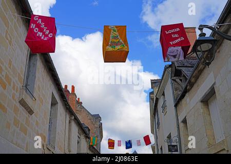 AZAY-LE-RIDEAU, FRANCE -24 JUN 2021- Street view of the village of Azay-le-Rideau, home of a landmark Renaissance castle, with suspended fabric lanter Stock Photo