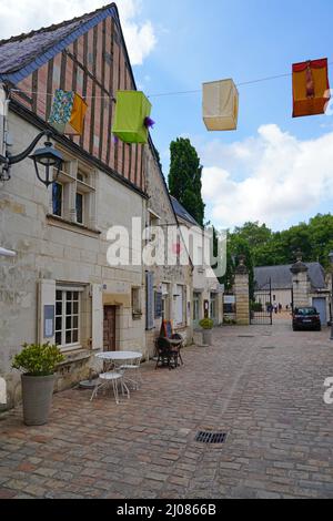 AZAY-LE-RIDEAU, FRANCE -24 JUN 2021- Street view of the village of Azay-le-Rideau, home of a landmark Renaissance castle, with suspended fabric lanter Stock Photo