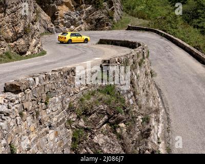 1995 Lancia Delta Integrale Evo II driving on historic Monte Carlo Rally stages and on the Route des Grandes Alpes  France. Stock Photo