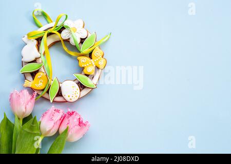 Happy Easter with pink tulips and cookies. Easter background Stock Photo
