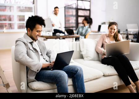 Young Diverse People Working In Coliving Space Stock Photo