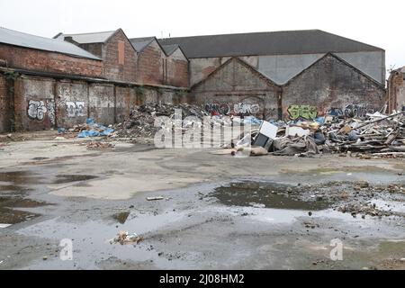 Rubbish dumped on waste ground, Glasgow, Scotland, UK Stock Photo