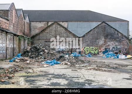 Rubbish dumped on waste ground, Glasgow, Scotland, UK Stock Photo