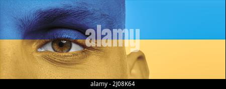 Double exposure of young man's face and Ukrainian flag, closeup Stock Photo