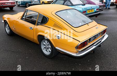 Three-quarter rear view of a Yellow, 1972, Triumph Spitfire Mk GT6 Mk3, on display at the 2021 Silverstone Classic Stock Photo