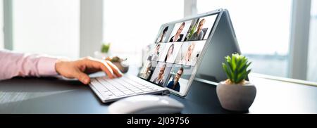 Online Video Conference And Digital Webinar On Screen Stock Photo