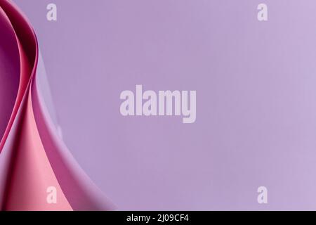 Abstract colored paper geometry composition background in violet, purple, magenta, pink color with curved lines and shapes Stock Photo