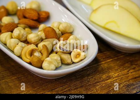 Nuts in the bowl, Close-up of mixed raw nuts in the bowl high angle view Stock Photo
