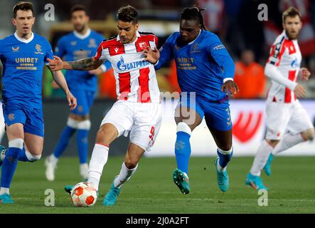 Belgrade, Serbia. 17th Mar, 2022. Red Star Belgrade's Ohi Omoijuanfo (L, front) vies with Glasgow Rangers' Calvin Bassey during the UEFA Europa League round of 16 second leg football match between Red Star Belgrade (Crvena Zvezda) and Glasgow Rangers in Belgrade, Serbia, March 17, 2022. Credit: Predrag Milosavljevic/Xinhua/Alamy Live News Stock Photo