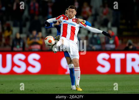 Belgrade, Serbia. 17th Mar, 2022. Red Star Belgrade's Milan Pavkov (front) competes during the UEFA Europa League round of 16 second leg football match between Red Star Belgrade (Crvena Zvezda) and Glasgow Rangers in Belgrade, Serbia, March 17, 2022. Credit: Predrag Milosavljevic/Xinhua/Alamy Live News Stock Photo