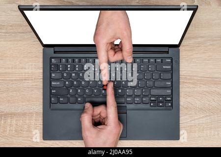 Touching fingers above computer keyboard. Two hands of touching with the index fingers. Business topics - connections. Business metaphor. Stock Photo