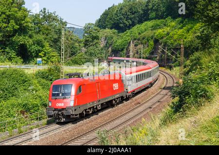 Amstetten, Germany - July 21, 2021: InterCity IC train of ÖBB Österreichische Bundesbahnen on Geislinger Steige near Amstetten, Germany. Stock Photo