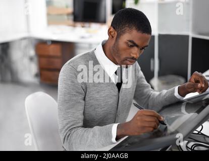 Smart technology makes everything easier. A young man working on a large touchscreen. Stock Photo