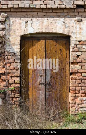 An old rustic door of a Indian railway quarter from the British colonial era Stock Photo