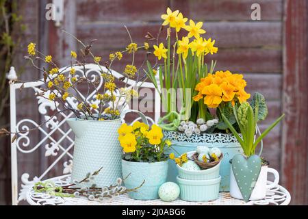easter decoration with yellow spring flowers and easter eggs Stock Photo