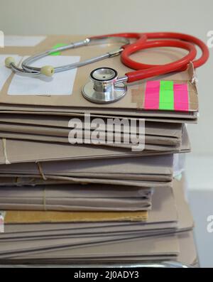 File photo dated 10/09/14 of a stethoscope on top of patient's files, as only one in 10 patients using an online system actually requests to see their GP face-to-face, according to study of more than 7.5 million records. Stock Photo