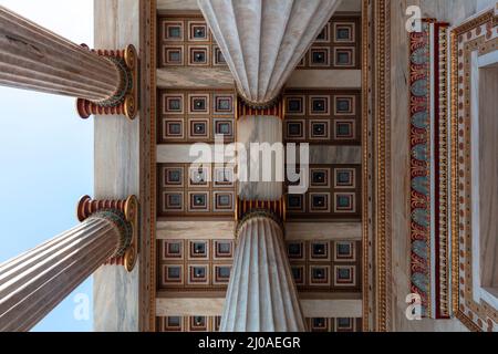 Athens Academy entrance ceiling under view. Greece. Classic column upper part and gold ornate roof, elegant neoclassicel building Stock Photo