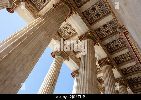 Athens Academy entrance ceiling under view. Greece. Classic column upper part and gold ornate roof, elegant neoclassicel building Stock Photo