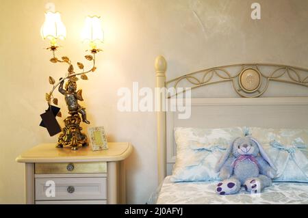 Toy hare on a bed Stock Photo