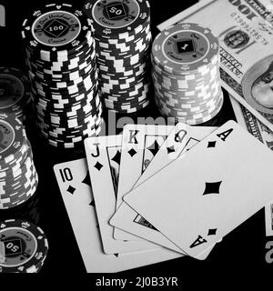 Poker chips Playing cards and dollars Stock Photo