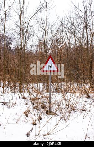 Vertical shot of a warning reverse curve or double curve traffic sign Stock Photo