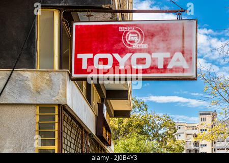 Toyota dealer in Maras /Varosha. The district of Varosha (Kapalı Maraş) in Famagusta (Cyprus) was between 1970 and 1974 one of the most popular tourist destinations in the world. Its Greek Cypriot inhabitants fled during the Turkish invasion of Cyprus in 1974, when the city of Famagusta came under Turkish control. It has remained abandoned ever since and the buildings have decayed. Stock Photo