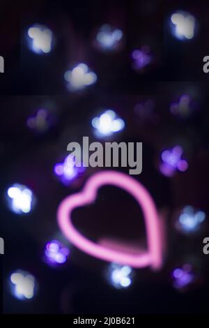 Neon love heart shape sign at night Stock Photo