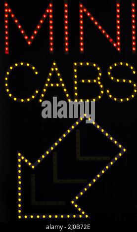 Mini cabs taxi neon sign light Stock Photo