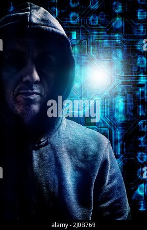 hoded hacker or cybercriminal Stock Photo