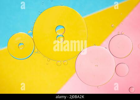 Abstract oil and water bubbles over colorful background. Oil drops creative background. Stock Photo