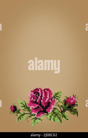 Cross embroidered rose on beige  background Stock Photo