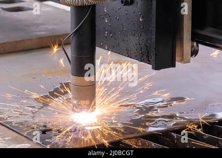 Plasma cutting machine working with sheet metal with sparks Stock Photo