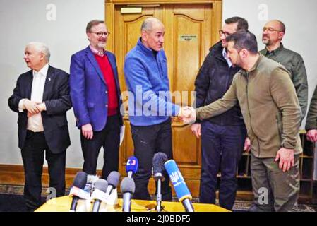 VOLODYMYR ZELINSKYY, President of Ukraine, shakes hands with Janez Jansa, Slovenian Prime Minister,in, in  Kyiv, 16 Karch 2022.  Others from left: Jaroslav Kaczynski, Polish Deputy Prime Minister, Petr Fiala, Czech Prime Minister, Mateusz Morawiecki, Polish Prime Minister and Denys Shmyhal, Prime Minister of Ukraine. Photo: Presidential Press Service Stock Photo