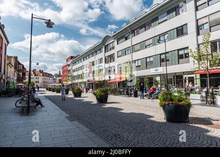 Falun, Dalarna- Sweden - 08 05 2019: People resting and walking in the shoppingstreet Stock Photo