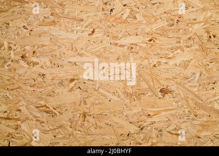 Background of the large wood chips pressed close up Stock Photo