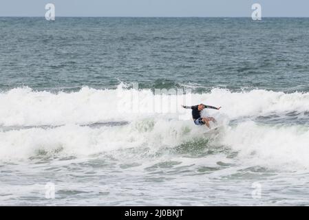 Surfers in action at the Brava beach in Florianopolis, Stock Photo