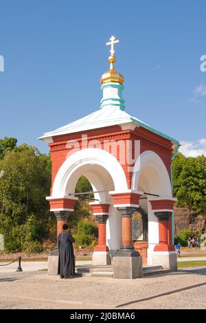 https://l450v.alamy.com/450v/2j0bma6/priest-baptized-in-front-of-the-chapel-chapel-of-all-who-sorrow-joy-russia-karelia-valaam-island-2j0bma6.jpg