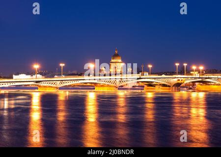 Blagoveshchensky (Leuteinant Schmidt) bridge and St. Isaac Cathedral in St.Petersburg, Russia. White night view from embankment. Stock Photo