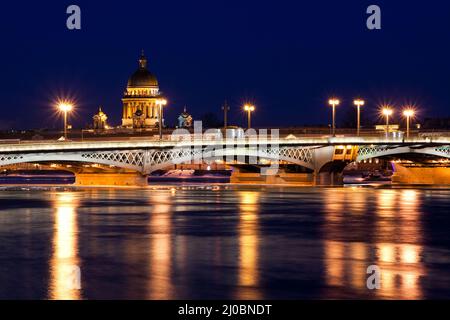 Blagoveshchensky (Leuteinant Schmidt) bridge and St. Isaac Cathedral in St.Petersburg, Russia. White night view from embankment. Stock Photo