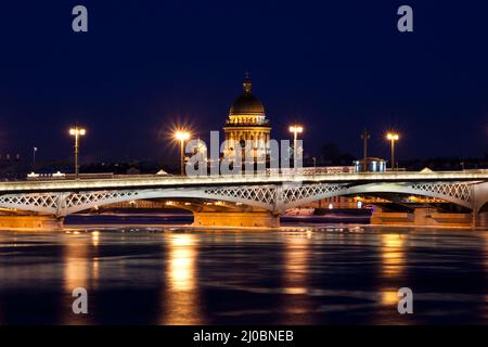 Blagoveshchensky (Leuteinant Schmidt) bridge and St. Isaac Cathedral in St.Petersburg, Russia. White night view from embankment. Stock Photo