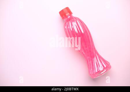 Three plastic bottles of soft drink on table  Stock Photo